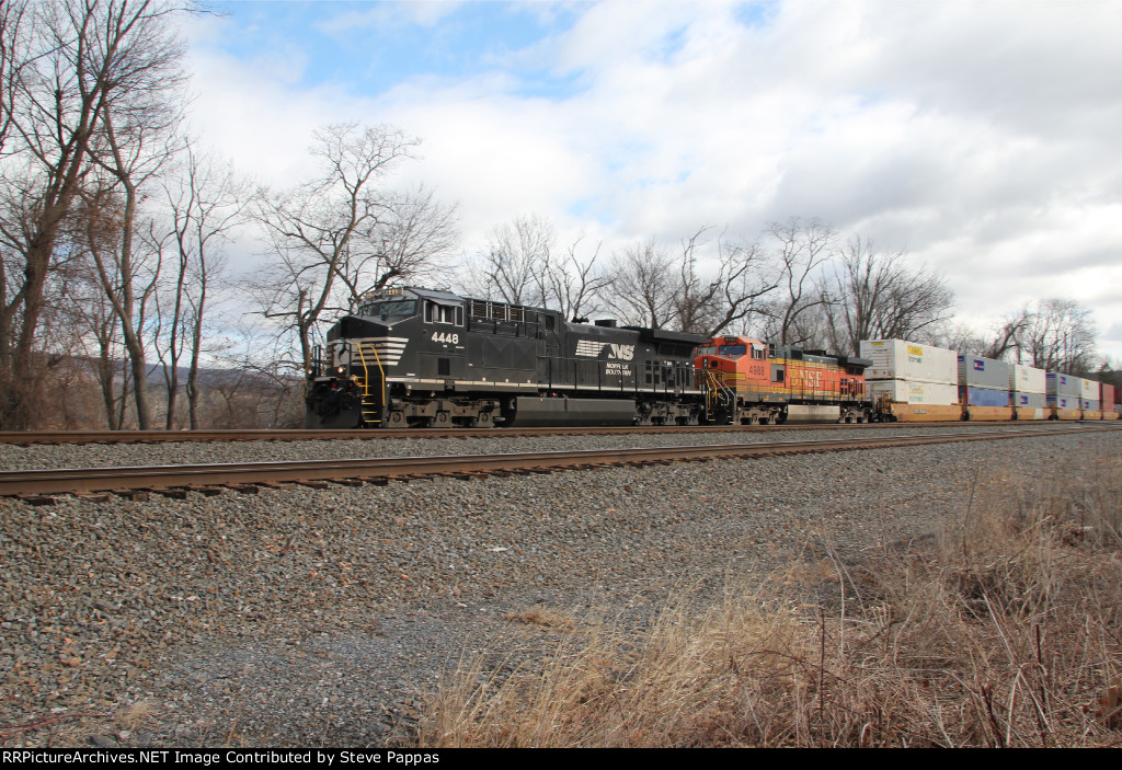 NS 4448 leads train 21G past MP116